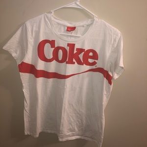 Red and white coke tee shirt.